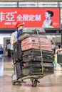 Railway porter at Beijing Railway Station South, China