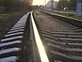 Railway or railroad tracks for train transportation goes into the distance Royalty Free Stock Photo