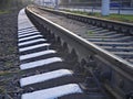 Railway or railroad tracks for train transportation goes into the distance Royalty Free Stock Photo