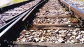 Railway. rails and old wooden sleepers close up. Rocky ground. Retro style Royalty Free Stock Photo