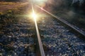 Setting sun and reflection on rails Royalty Free Stock Photo