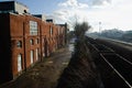 Railway road along industrial brick buildings