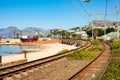 Railway running through the small coastal harbor town of Kalk Bay in Cape Town, South Africa