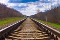 Railway station against a beautiful colorful sky at sunset. Industrial landscape with railroad, blue sky with clouds in summer. Royalty Free Stock Photo