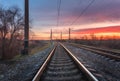 Railway station against beautiful sky at sunset. Railroad Royalty Free Stock Photo