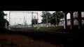 Railway station and the bridge in the late evening. Stock footage. View from under the bridge on the rails, graffiti Royalty Free Stock Photo