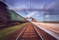 Railway station with cargo wagons in motion blur effect at sunse Royalty Free Stock Photo