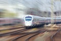 Railway station with modern white train at sunset Royalty Free Stock Photo