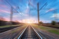Railway station with motion blur effect. Blurred railroad Royalty Free Stock Photo