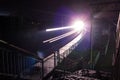 Railway station at night with a passing train Royalty Free Stock Photo