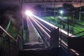 Railway station at night with a passing train Royalty Free Stock Photo