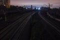 Railway station at night with a passing train Royalty Free Stock Photo