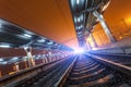 Railway station at night. Train platform in fog. Railroad Royalty Free Stock Photo