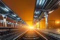 Railway station at night. Train platform in fog. Railroad Royalty Free Stock Photo