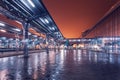 Railway station at night. Train platform in fog. Railroad Royalty Free Stock Photo