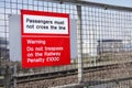 Railway station passengers must not cross rail line danger warning sign do not trespass penalty fine law