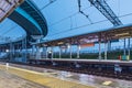 Railway station platform at evening time. Royalty Free Stock Photo
