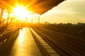 Railway station at platform in sunset