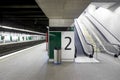 Railway station with signposting platforms and escalators