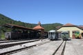 Railway station with steam and diesel locomotive