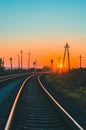 Railway at summer sunset. Vertical scenic view