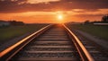 railway at sunset train tracks goes to horizon majestic sunset orange Royalty Free Stock Photo