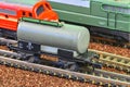 Railway tanker truck. Train hobby model on the model railway. Railroad platforms for transporting of liquid goods and