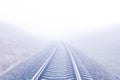 Railway to foggy horizon Royalty Free Stock Photo