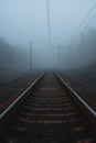 Railway to horizon in fog Royalty Free Stock Photo