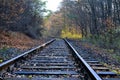 Railway track in the autumn forest on a sunny autumn day, North Moravia, Czech Republic