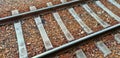 Railway track and ballast stones, close-up view