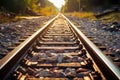 Railway track bathed in sunlight, adorned with ballast and gravel Royalty Free Stock Photo