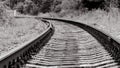 The railway track goes into the distance, black and white photo Royalty Free Stock Photo