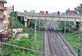 The railway tracks and bridge is over the tracks