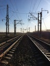 Railway tracks and electric transmission lines Royalty Free Stock Photo