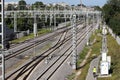 Railway tracks go into the distance. Railway power lines. Lines, diagonals, rhythm. City. Industrial landscape.