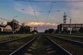 Railway tracks going in the direction of a beautiful sunset. Royalty Free Stock Photo