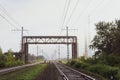 Railway tracks going into the fog, pipelines and chimneys in the haze Royalty Free Stock Photo