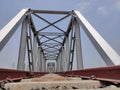 Railway tracks iron bridge unique angle shot with flat sky Royalty Free Stock Photo