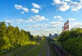 Railway tracks junctions near power plant chimneys Royalty Free Stock Photo