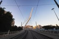 The railway tracks of the light rail in Jerusalem against the background of the famous string bridge at the entrance to the city Royalty Free Stock Photo