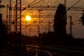 Railway tracks and overhead lines at sunset, Sremska Mitrovica, Serbia Royalty Free Stock Photo