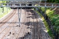 Railway tracks with power supply and signals Royalty Free Stock Photo