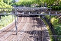 Railway tracks with power supply and signals Royalty Free Stock Photo