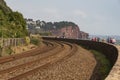 Railway tracks run along the coast at Teignmouth, Devon, UK