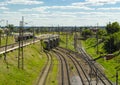 Railway tracks with switches and interchanges with Railway bridges. Wires and electric posts. High angle view with perspective. Royalty Free Stock Photo