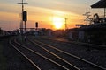 Railway Tracks at Train Station during sunset Royalty Free Stock Photo
