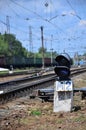 Railway traffic light semaphore against the background of a day railway landscape. Signal device on the railway trac Royalty Free Stock Photo