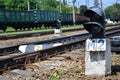 Railway traffic light semaphore against the background of a day railway landscape. Signal device on the railway track Royalty Free Stock Photo