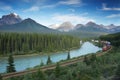 Railway with train in Banff National Park, Canada Royalty Free Stock Photo